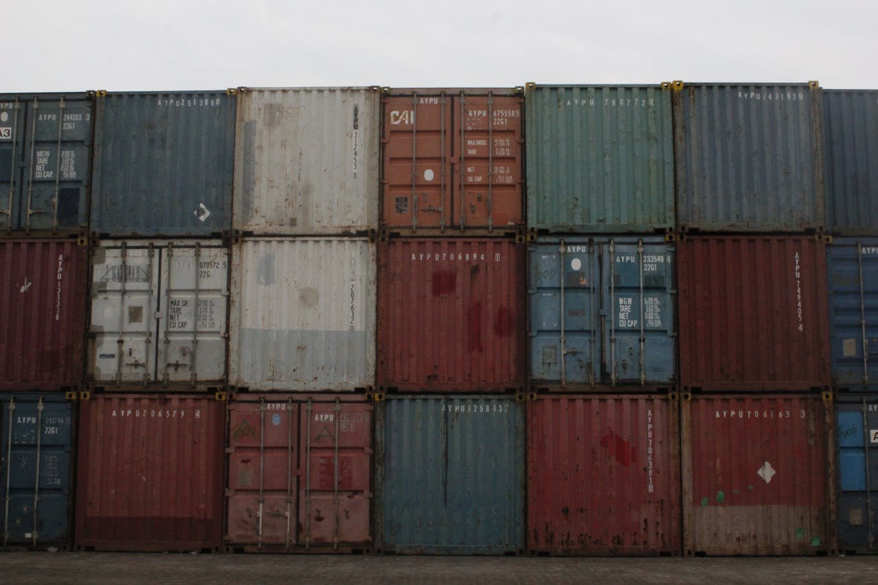 A collection of colorful stacked cargo containers at Jakarta port, Indonesia.